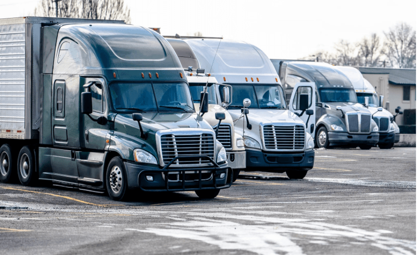 moving trucks parked in the snow